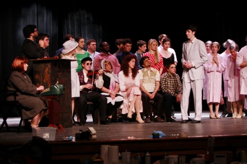 Mrs. Amy Tassin had a small role as the court stenographer in the Phils' 2013 spring production of The Producers. She is seated far left on stage.