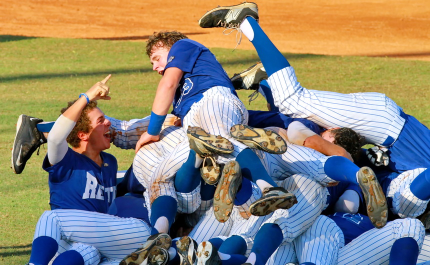 The Oilers pile on after Trent Forshag scores the winning run on a hit by Scott Crabtree in the bottom of the ninth inning.