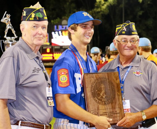 American Legion officials Rich Anderson (left) and Larry Price announce that Ben Hess is the recipient of the annual James F. Daniel, Jr. Memorial Sportsmanship Award, presented to the World Series player who best represents teamwork, loysaslty, cooperation, self-reliance, fair play, and courage.