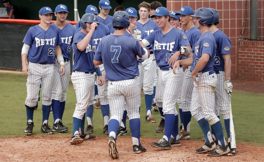 Scott Crabtree is greeted by his teammates after smashing a three-run home run in the top of the 6th inning with two outs. (Photos by Karen E. Segrave)