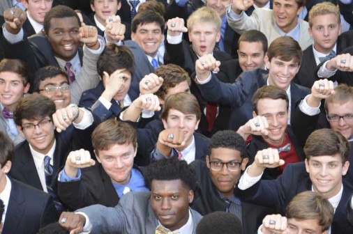 Seniors show off their rings after the 2015 Ring Mass.