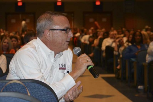 Tom Toups, parent of pre-freshman Cole Toups, asks a question during Thursday night's town hall meeting.
