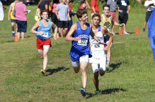 Sophomore Bert Gilmore holds off runners from Rummel, John Curtis, and Holy Cross as he sprints to the finish.