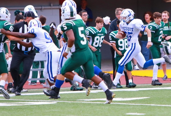 Defensive back Matt McMahon runs back an interception from the Jesuit end zone to the 36-yard line.
