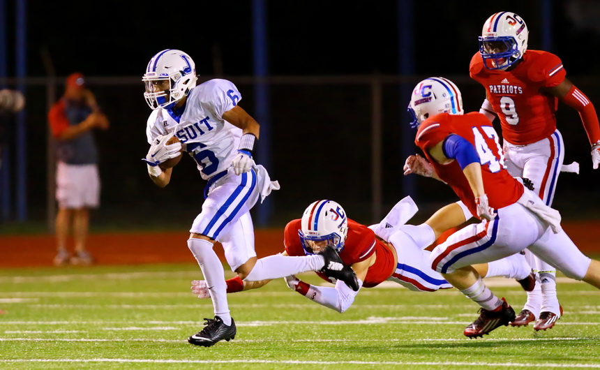 On third and nine in the first series for Jesuit, quarterback Peter Hontas completes a short pass to Malachi Hull, who escapes these Patriots to pick up a first down and more.