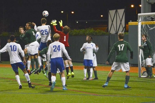 Senior Patrick Rye outjumps the Newman goalie to score Jesuit's second goal of the evening.