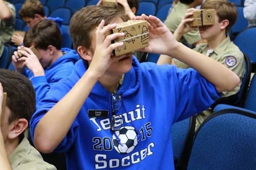David Hart looks through a Google Cardboard viewer to take a virtual field trip to Barcelona with his Spanish class.