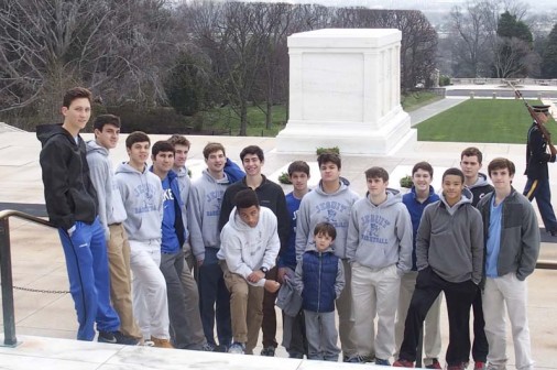 Jesuit basketball team members and coaches pose at Arlington National Cemetery (photo courtesy Meg Jennings).