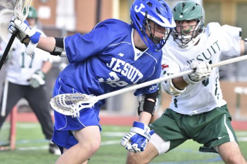 Junior Michael Smart (32) uccessfully keeps the ball away from a Strake Jesuit defender. The Blue Jays emerged victorious, 13-9. The game was played in Houston on Saturday, Feb. 13.