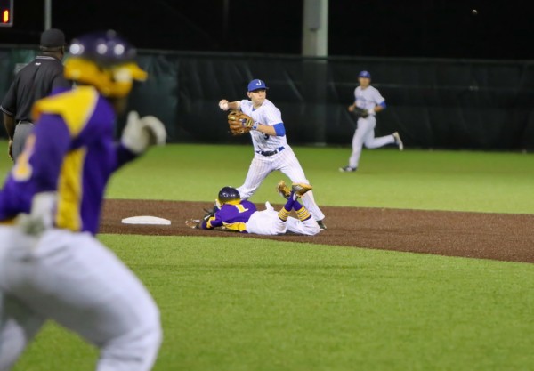 A 3-6-3 double play: In the bottom of the fifth inning, a grounder is caught by first baseman Marshall Lee, who throws to shortstop Marc Theberge for the out at second base. Theberge throws back to Lee for the out at first base.