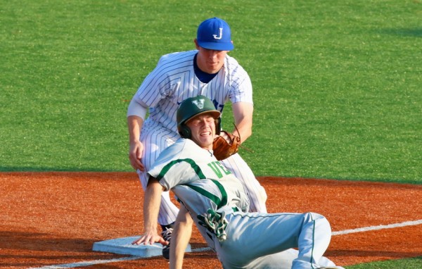 Hayden Fuentes puts the tag on this  Indian runner whose slide into third base went a little too far.