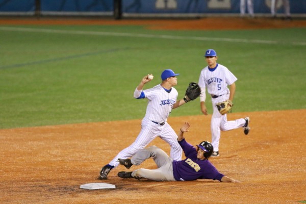 ... Nick Ray gets the forced out at second base but is off-balance on his throw to first base for the double play.