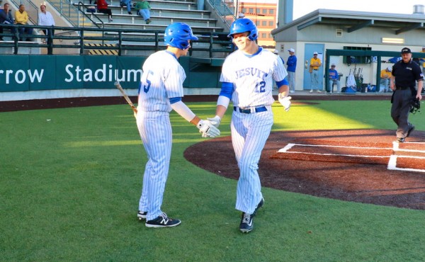 Nick Ray hit a home run in the first inning of the first game this season and is congratulated by Brandon Briuglio, who over the weekend hit two home runs in the opening inning of Jesuit's game against St. Thomas More.. 