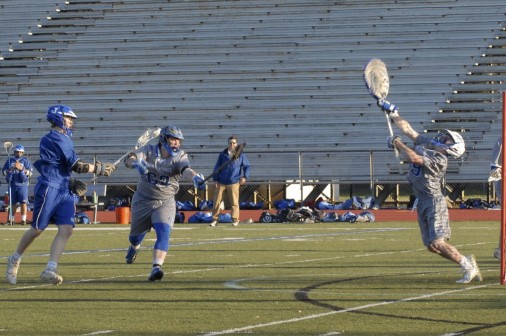 Junior attacker Noah Martin shoots and scores against Ocean Springs on Monday, March 21. Photo by Lorraine Faust.