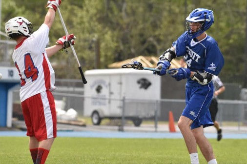 Junior attacker Jeremy Hamilton fakes high and shoots low for a Blue Jay score. Hamilton led the team with five goals in the 21-0 trouncing of Pascagoula.