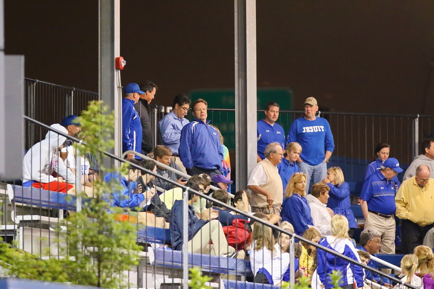 Some of the faithful at John Ryan Stadium stand during the "5th Inning S-t-r-e-t-c-h."