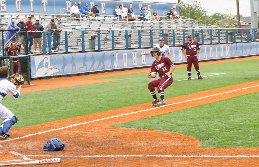 Catcher Josh Schmidt and third baseman Hayden Fuentes trap this Falcon for a huge out in the fourth inning.
