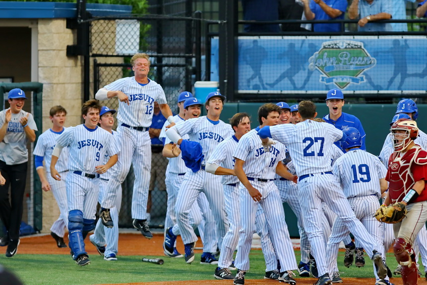 As Stephen Sepcich gets to his feet, the Jays come rushing out of the dugout to celebrate his home run.
