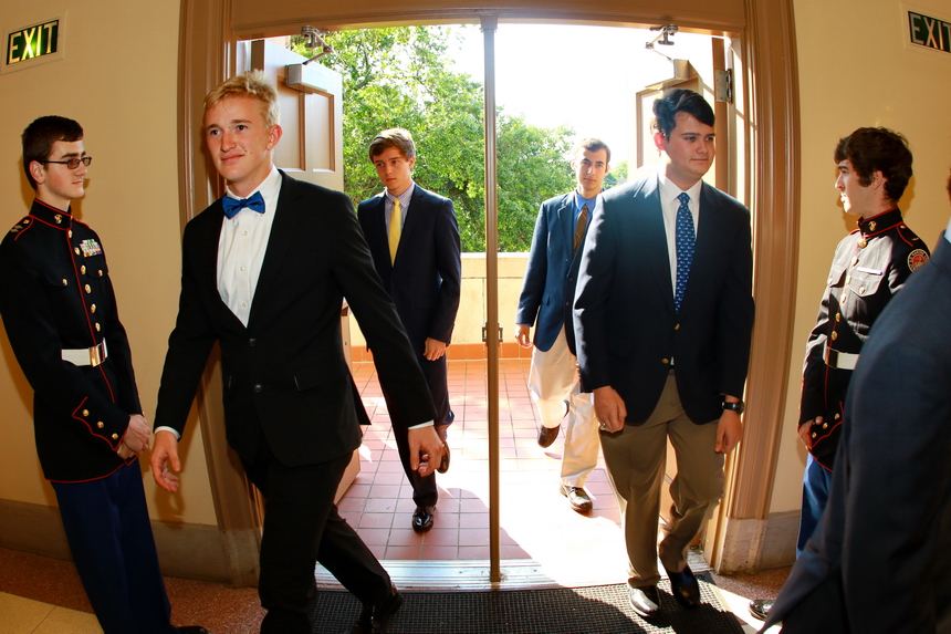 Flanked by MCJROTC junior cadets John Crowson (left) and Santiago Cambias, seniors process up the stairs of the Chapel of the North American Martyrs for their Baccalaureate Mass. Clockwise, from left: Dillon Fuchs, Reid Detillier, Sterling Stafford, and Daniel Puente.