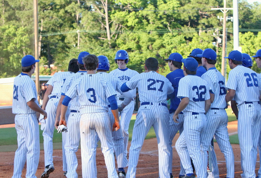 Connor Maginnis hit his first home run as a Blue Jay in the second inning. As he completes his round trip around the bases, teammates are ecstatic for him.