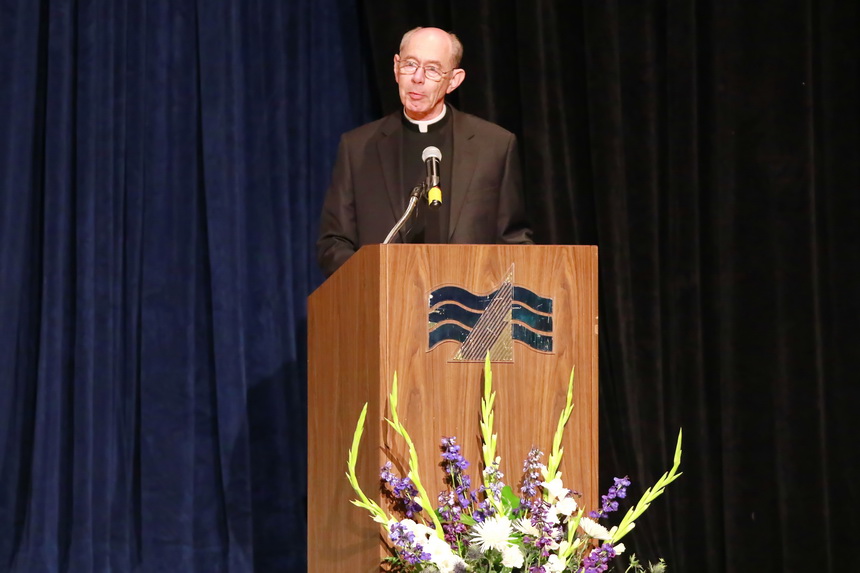 Fr. McGinn delivers his final address to Jesuit graduates, telling them: "Be patient, be humble, be grateful, and be open to challenges because life is a dance you learn as you go."