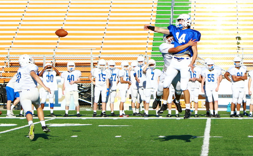 Wide receiver Ashton Loria (14), who will be a senior on the team next year, can't haul this high pass in during last week's intrasquad scrimmage.