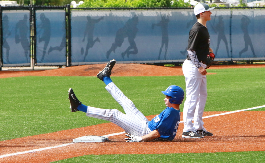 Mack Miller slides into third base, a bit ungracefully, but who cares since he pounded a triple to right center field in Retif's games against Lakeshore.
