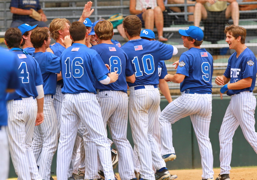 Alex Watermeier is mobbed by his teammates after smashing a solo home run in the sixth to extend Retif's lead to 4-1 over Ponstein's in Sunday's championship game.