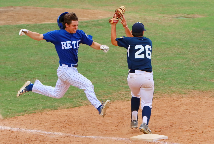 Tripp Ledet is one half leap short of getting to first base safely in Sunday's championship game against Ponstein's.