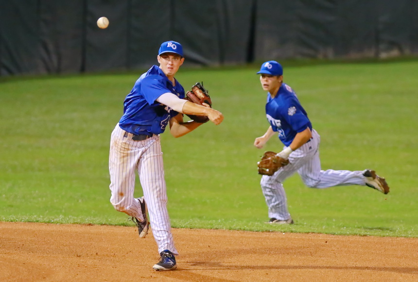 Third baseman Hunt Conroy throws to Marshall Lee at first base for an out.