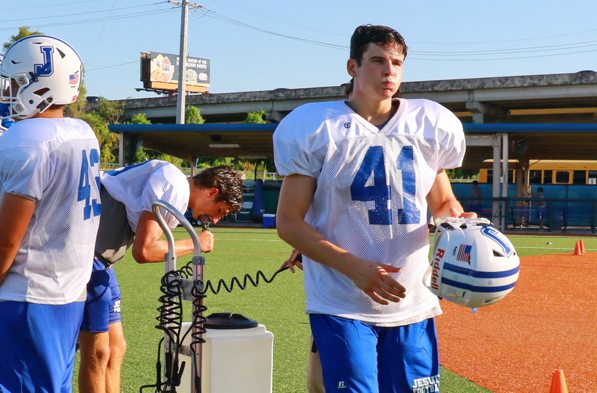 For senior defensive back Matt McMahon (41) and other Blue Jays, the popular water machines were essential to staying hydrated. 