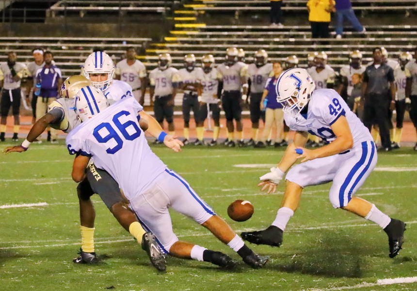 Defensive end Matthew Frischhertz (96) clobbers the Easton quarterback, forcing a fumble that the Jays recover. Jesuit's defense will have to pressure the Wolves all night long.