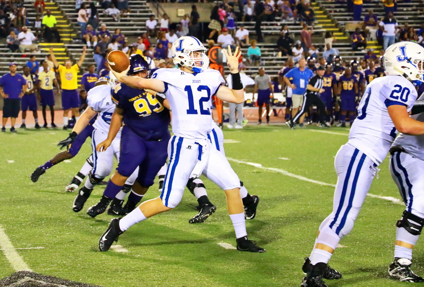 Quarterback Alex Watermeier throws a short pass to tight end Marshall Lee in the fourth quarter. Jesuit had 172 yards rushing and 68 yards passing for 240 yards of offense. St. Aug had 246 yards of total offense: 123 yards rushing, 123 yards passing.