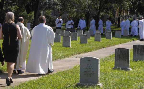 Following the Mass, the congregation processed to the burial site adjacent to the church in Grand Coteau.