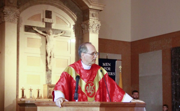 Fr.Fitzgerald delivers the homily for the Mass of the Holy Spirit in August 2013.