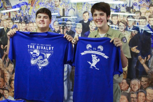 Seniors William King and Mahlon Ruegge sell the official 2016 Rivalry Game t-shirt during lunch.