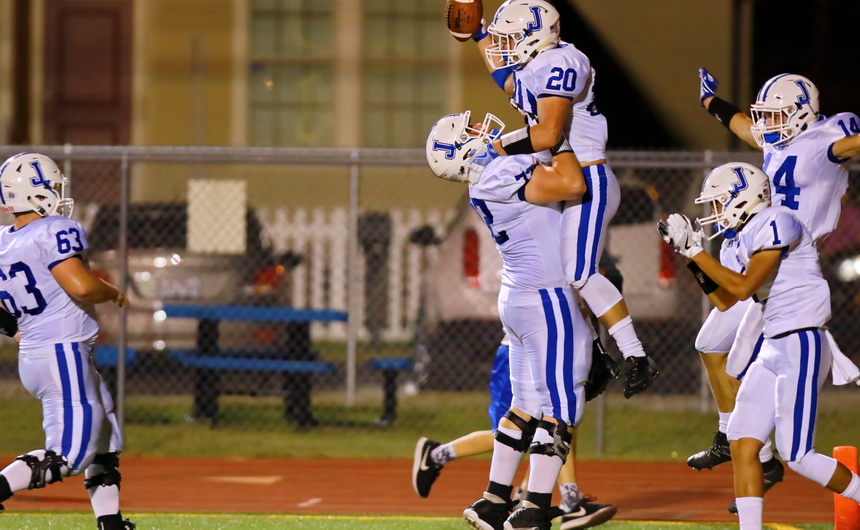 The Jays' big lineman Corey Dublin hoists Connor Prouet after the running back caught a screen pass from quarterback Denny McGinnis and raced 39 yards for a touchdown in Jesuit's game against Rummel.