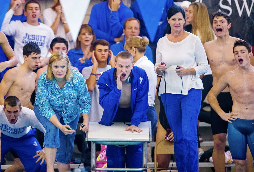 Jonathan Vegh (far left), co-captain Josh Armond (center) and Michael Foley (far right) cheer for their teammates in the 200-yard medley relay. The Jays placed second in the event, 20/100th of a second behind the Catholic High team.  (Photo by Rick Hickman/American Press)