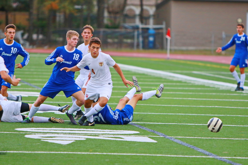 Bodies strewn about, Hunt Navar (10) and Ashton Perkins (18) try to find Brother Martin's goal late in the game.
