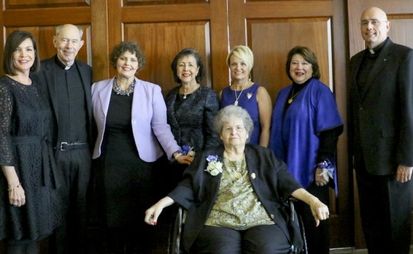 From left, general chair Denise Currault, Fr. Anthony McGinn, S.J., honoree Liz Creel, honoree Suzette Herpich, honoree Kim DeVun, honoree Sheila Vocke, Fr. Christopher Fronk, S.J., and honoree Marilyn Beauford.