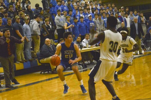 Holy Cross Coach implores someone, anyone, to try to guard Jesuit senior Collin Kulivan during the senior's 16-point first half on Friday, Jan. 6.