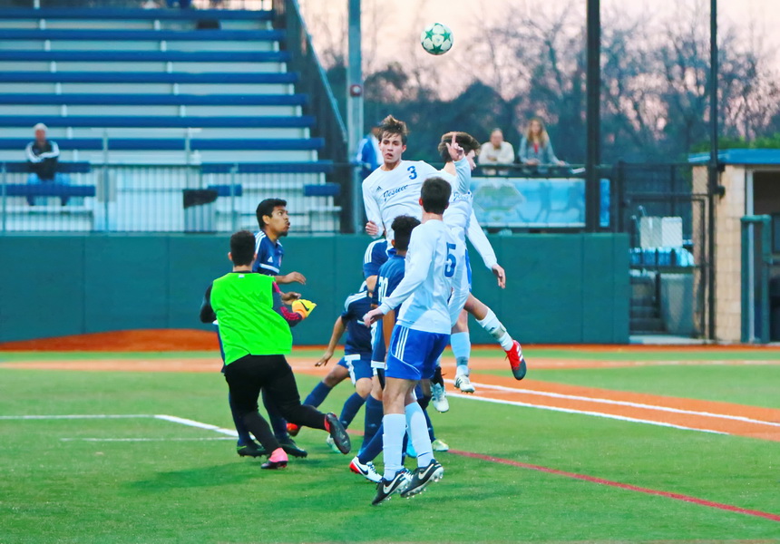 Senior defender Vincent Baumer (3) and senior midfielder Patrick Reese soar for this header on a corner kick in the opening minutes of Jesuit's match against John Ehret on Tuesday at John Ryan Stadium. The Jays had four or five chances to score in the opening 15 minutes of the match, but could not get the ball into the net.