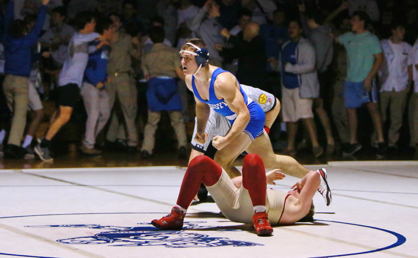 Paul Treuting, the hero of the match, gets up after pinning his opponent in the second to last dual.