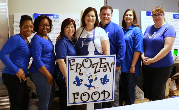 The warm and friendly volunteers of the Frozen Foods Booth: (from left) Kimberly Francis, Paulette Wilson, Wendy Rodrigue, April Pertuit, Rodney Wild, Tiffany Crowson, and Tracy Passantino.