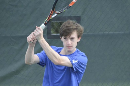 Sophomore David Nimmo follows through on a backhand during his win at Line 1 singles in Jesuit's win over Rummel on Feb. 23.
