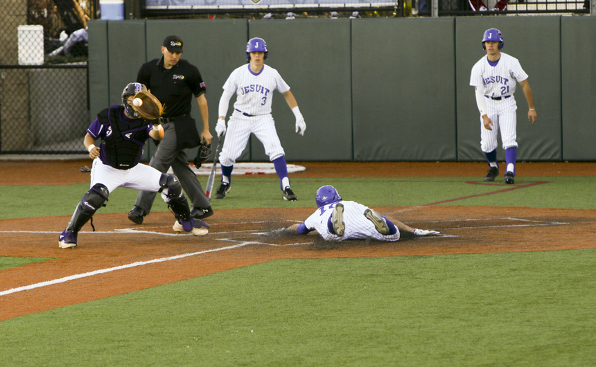 Nick Ray slides in home after blasting a triple to left field. After a fielder's error, Ray was able to make it home and tally two RBI's on the hit.