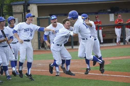 Marshall Lee is mobbed at home plate after delivering a two-out, three-run homer in Jesuit's 10-4 win over Rummel on Saturday, April 15.