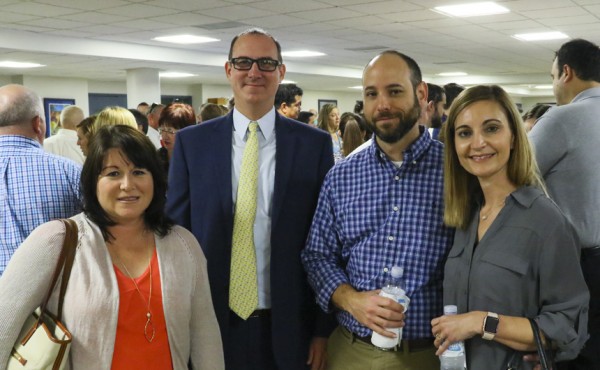 Jesuit's principal Mr. Peter Kernion visits with Becky Compton (left) and Jason and Jodie Cavignac (right) at the reception following the presentation.