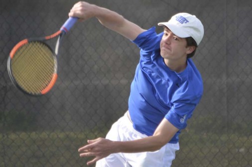 Sophomore Cole LaCour serves one up in Jesuit's win over Holy Cross on Tuesday, April 4.