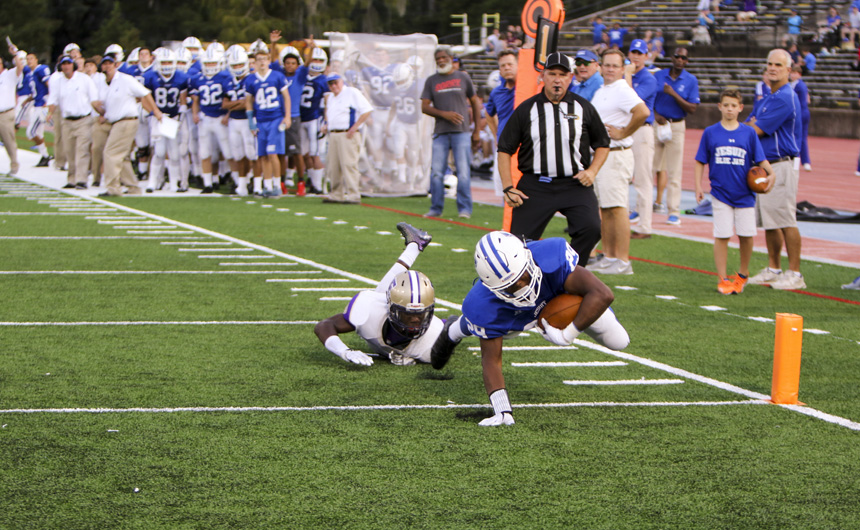 Junior running back Willie Robinson dives across the goal line to give Jesuit their only lead of the night, 7-6.